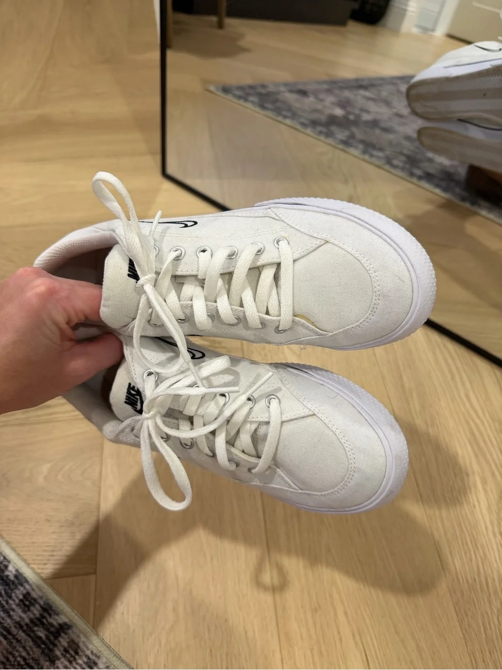 Nike Women’s White Canvas Sneakers with Black Swoosh